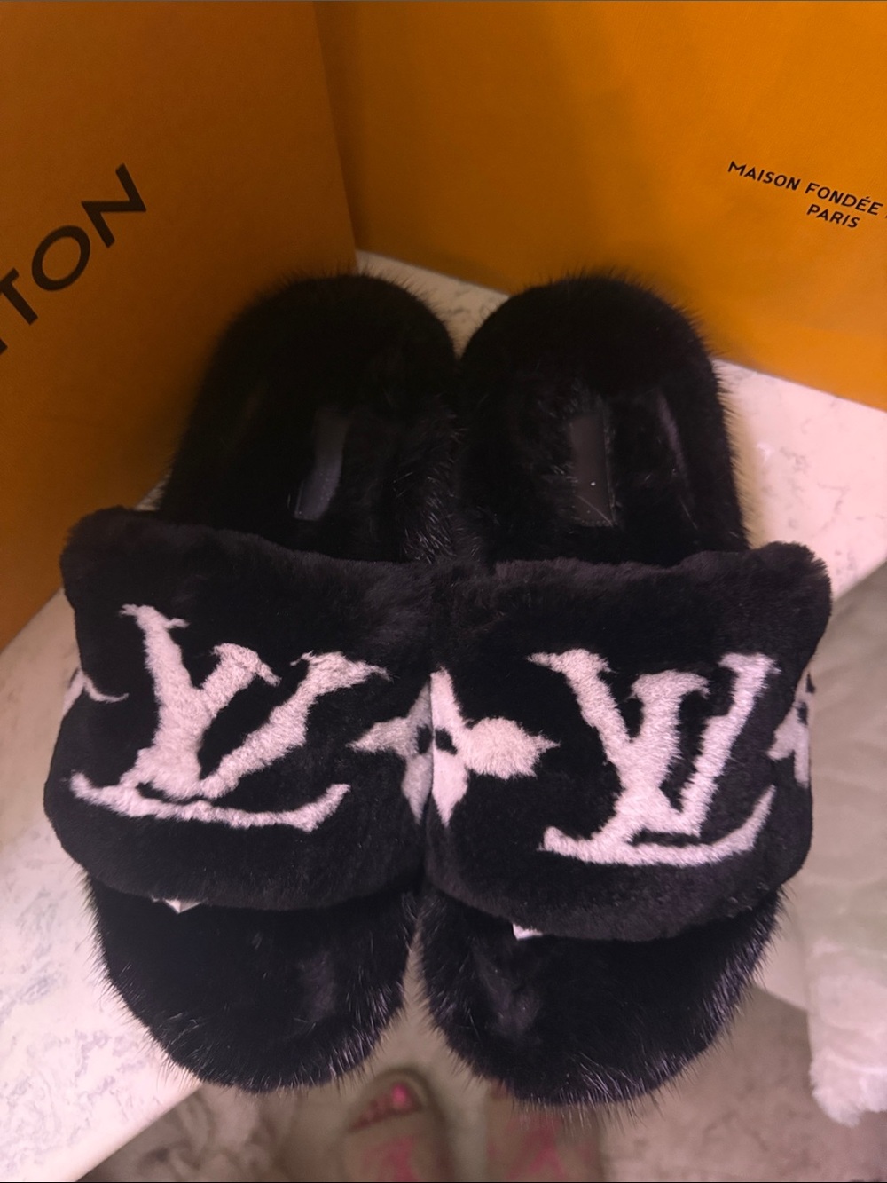 Louis Vuitton Black and White Fur Logo Slides
Shearlings